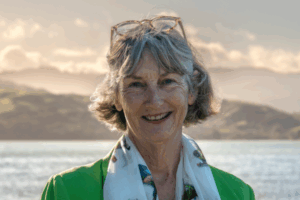 Moira Lawler speaking at her campaign launch event at the RSA in Pukerua Bay, surrounded by local residents.
