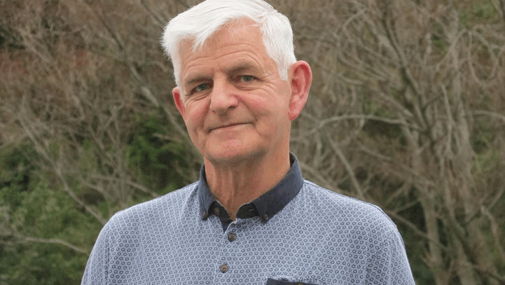 Mike Duncan announces re-election bid for Porirua City Council Porirua City Councillor Mike Duncan standing outdoors, smiling, with native bush in the background.