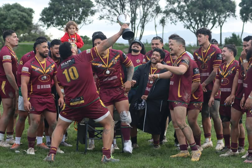Porirua Vikings Celebrate Tier 2 Victory Porirua Vikings Premier team celebrating their Tier 2 Division rugby league win with trophy and medals.