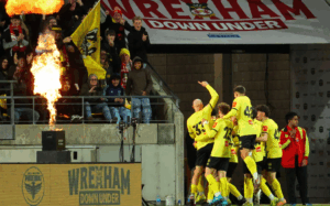 Wellington Phoenix players celebrate a goal against Wrexham during a pre-season friendly at Sky Stadium.
