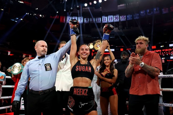 Cherneka Johnson Crowned Undisputed Champion Cherneka Johnson raises her arms in victory after winning the undisputed bantamweight world title at Madison Square Garden.