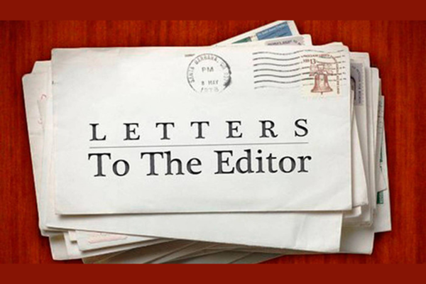 Letters to the Editor Stack of envelopes with one prominently labelled “Letters To The Editor” on the front.