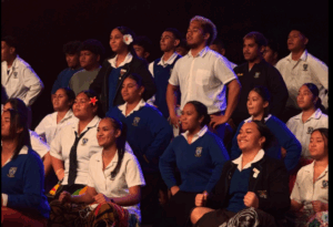 Students from Wellington region colleges perform traditional Pacific songs on stage during Te Kiwa Nui 2025.