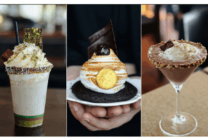 Three indulgent chocolate-themed desserts: a pistachio-topped milkshake with whipped cream, a chocolate tart topped with toasted meringue and a gold chocolate coin, and a chocolate cocktail rimmed with nuts and garnished with whipped cream and chocolate pieces.