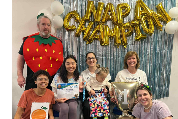 NAPA Team Celebrates Porirua Pop-Up Success Group of therapists and a child posing under “NAPA Champion” balloons at a paediatric therapy event in Porirua, New Zealand