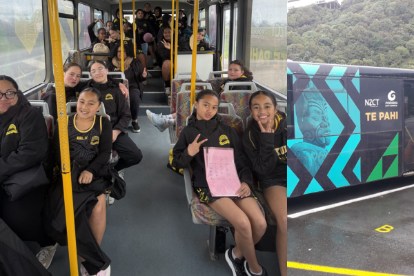 Group of school-aged children sitting inside a community bus and smiling at the camera; side view of Te Pahi bus with Māori artwork and Porirua City Council branding.