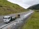 Construction vehicles and traffic cones along State Highway 1 Transmission Gully during summer maintenance to upgrade drainage and improve road safety.