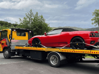 Police vehicles parked outside a residential property in Pauatahanui during a multi-agency operation targeting organised drug offending.
