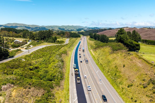 Road cones and traffic control signs along a highway near Porirua during maintenance work.
