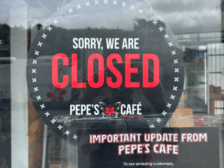 Closed sign displayed on the door of Pepe’s Cafe in Porirua.
