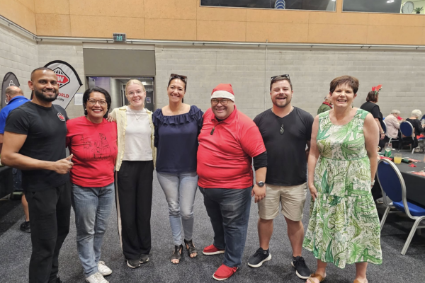 Sushil Ravikumar stands with local MPs, councillors and the mayor at the Over 70s Christmas Luncheon in Porirua.