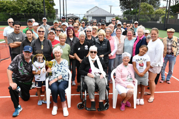 Members and supporters of Titahi Bay Tennis Club gather on the courts during centenary celebrations marking 100 years since the club was founded.