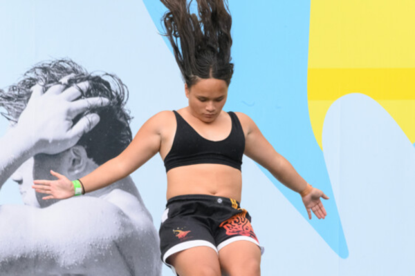 Zerenity Mill-Simpson, 2025 Z Manu World Champs female youth champion, mid-jump during a manu competition.