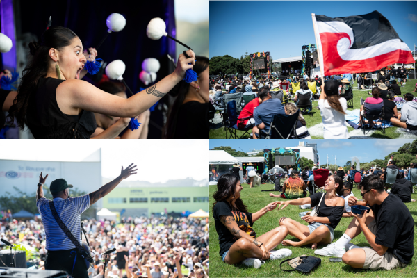 Crowds gather at an outdoor festival in Porirua, with performers on stage and people seated on the grass, some holding a tino rangatiratanga flag.