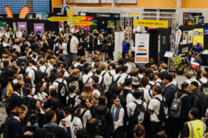Students gather around exhibition stands during the Careers Expo 2025 at Te Rauparaha Arena in Porirua.