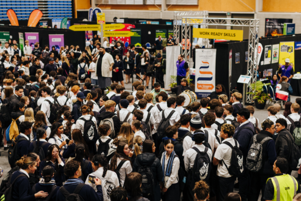 Students gather around exhibition stands during the Careers Expo 2025 at Te Rauparaha Arena in Porirua.