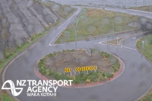 Aerial view of a roundabout connecting multiple streets, with roads branching out in several directions and surrounding urban layout visible.