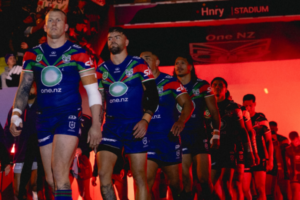 Warriors players walk onto the field at Hnry Stadium in Wellington ahead of their ANZAC Round match against the Dolphins.