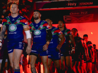 Warriors players walk onto the field at Hnry Stadium in Wellington ahead of their ANZAC Round match against the Dolphins.