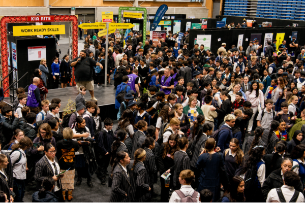 Crowds of secondary school students and jobseekers fill Te Rauparaha Arena during the Porirua Careers Expo, visiting exhibitor stalls and speaking with employers and training providers.