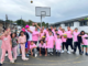 Porirua tamariki and rangatahi stand together on a school basketball court during a Ko Wai Au activity.