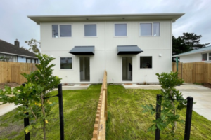 New two-storey state homes on Cornwall Crescent with fenced lawns and concrete driveways.