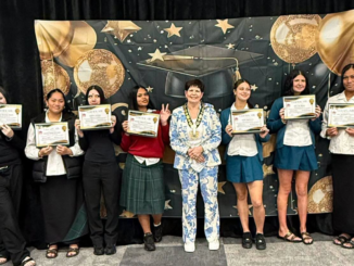 Graduates hold certificates beside Porirua Mayor Anita Baker at the Polynesian Beauty Academy Gateway Class Graduation.