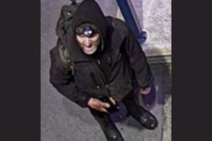 Police are seeking to identify a person wearing dark clothing and a hood, pictured at Takapu Road Station in Tawa.