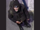 Police are seeking to identify a person wearing dark clothing and a hood, pictured at Takapu Road Station in Tawa.