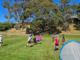 Children play football on a grass field during a Porirua City AFC junior session.