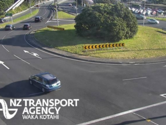 Traffic moving through a Porirua state highway roundabout, viewed from an NZTA traffic camera.
