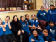 Postgate School students in blue uniforms with MP Debbie Ngarewa-Packer during their visit to Parliament.