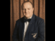 Portrait of Russell Robinson wearing a New Zealand billiards blazer and bow tie.