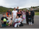 Ngāti Toa School students with tennis player Ayla Giesen and Nuku Ora facilitator Tash Snook after receiving new sports balls.