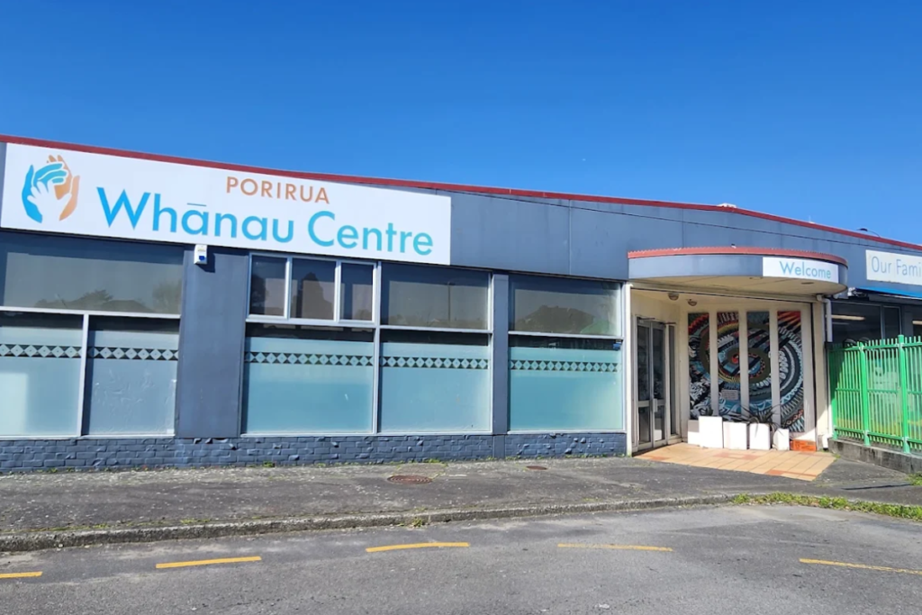 Exterior view of Porirua Whānau Centre building with the centre sign visible above the entrance.