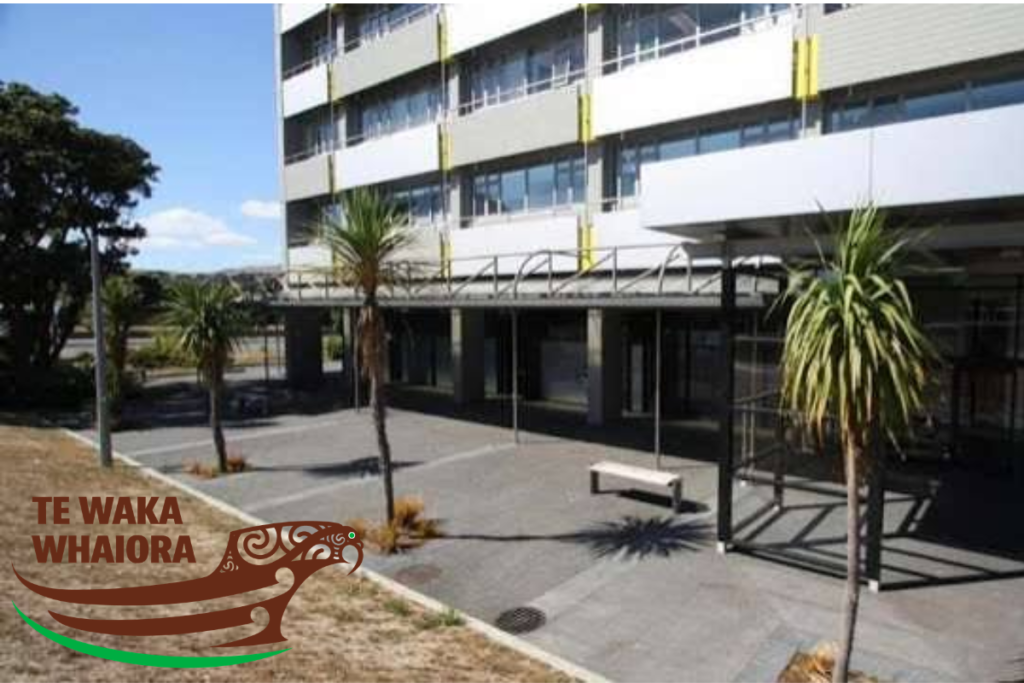 Te Waka Whaiora building in Porirua, with the organisation’s logo displayed in the lower left of the image.
