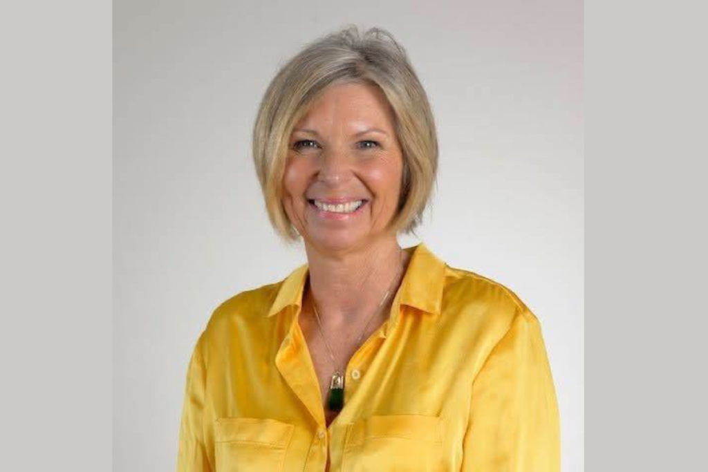 Former Porirua City Councillor Tracy Johnson smiling for a portrait.
