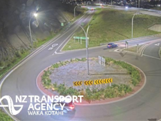 Night-time view of a roundabout and motorway interchange on Transmission Gully near Porirua.