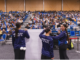 Aotea College students lead hundreds of tamariki in waiata at Te Rauparaha Arena during Porirua’s Te Wiki o te Reo Māori celebrations.