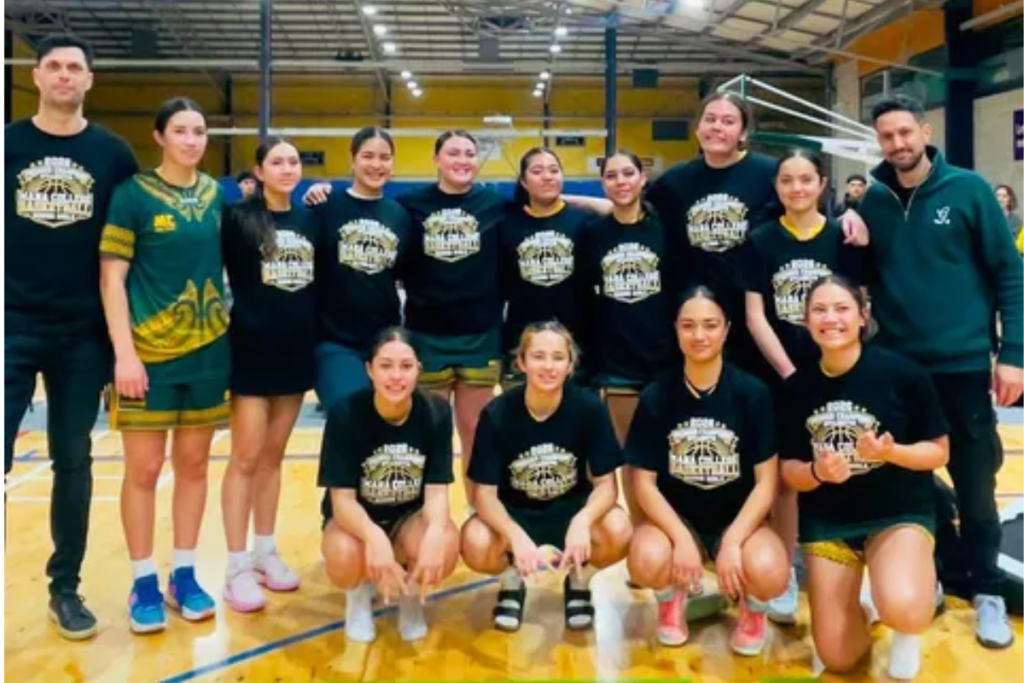 Mana College Senior Girls basketball team posing together on court after winning the Zone 3 Lower North Island championship.