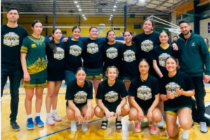 Mana College Senior Girls basketball team posing together on court after winning the Zone 3 Lower North Island championship.