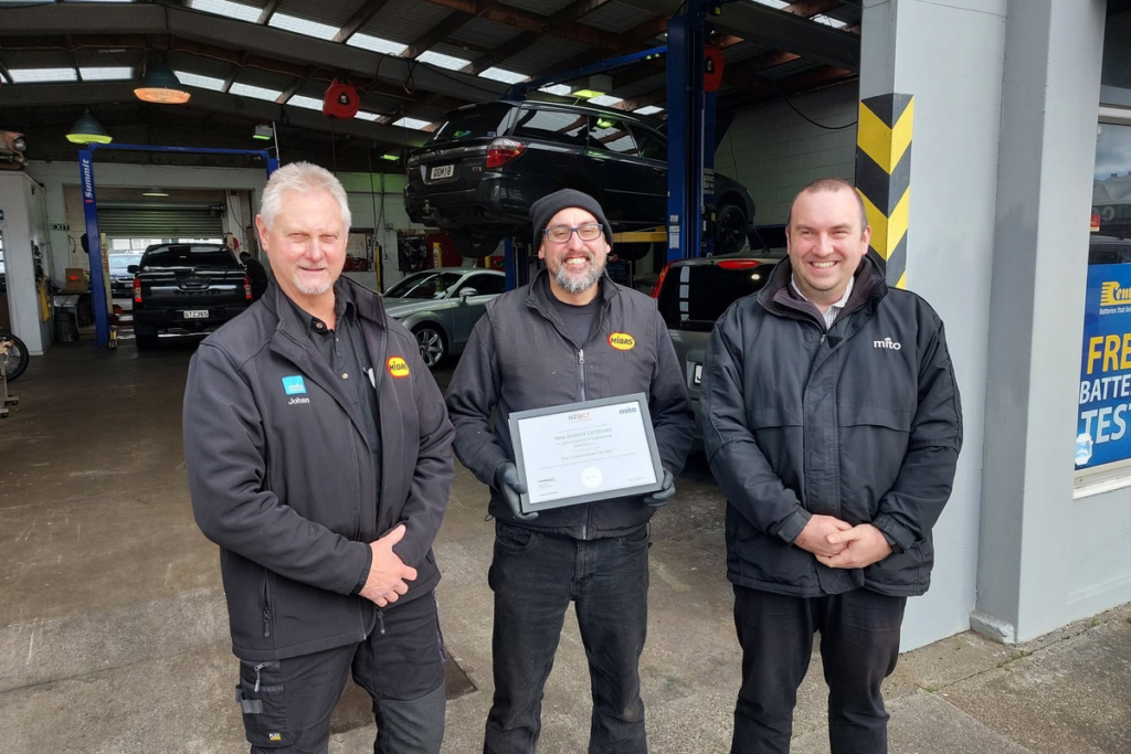 Johan Bester, left, with two men outside the Midas Porirua workshop.