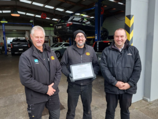 Johan Bester, left, with two men outside the Midas Porirua workshop.