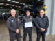 Johan Bester, left, with two men outside the Midas Porirua workshop.